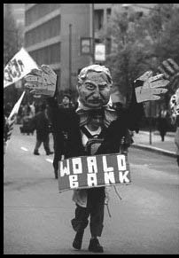 A woman carrying a puppet in protest.